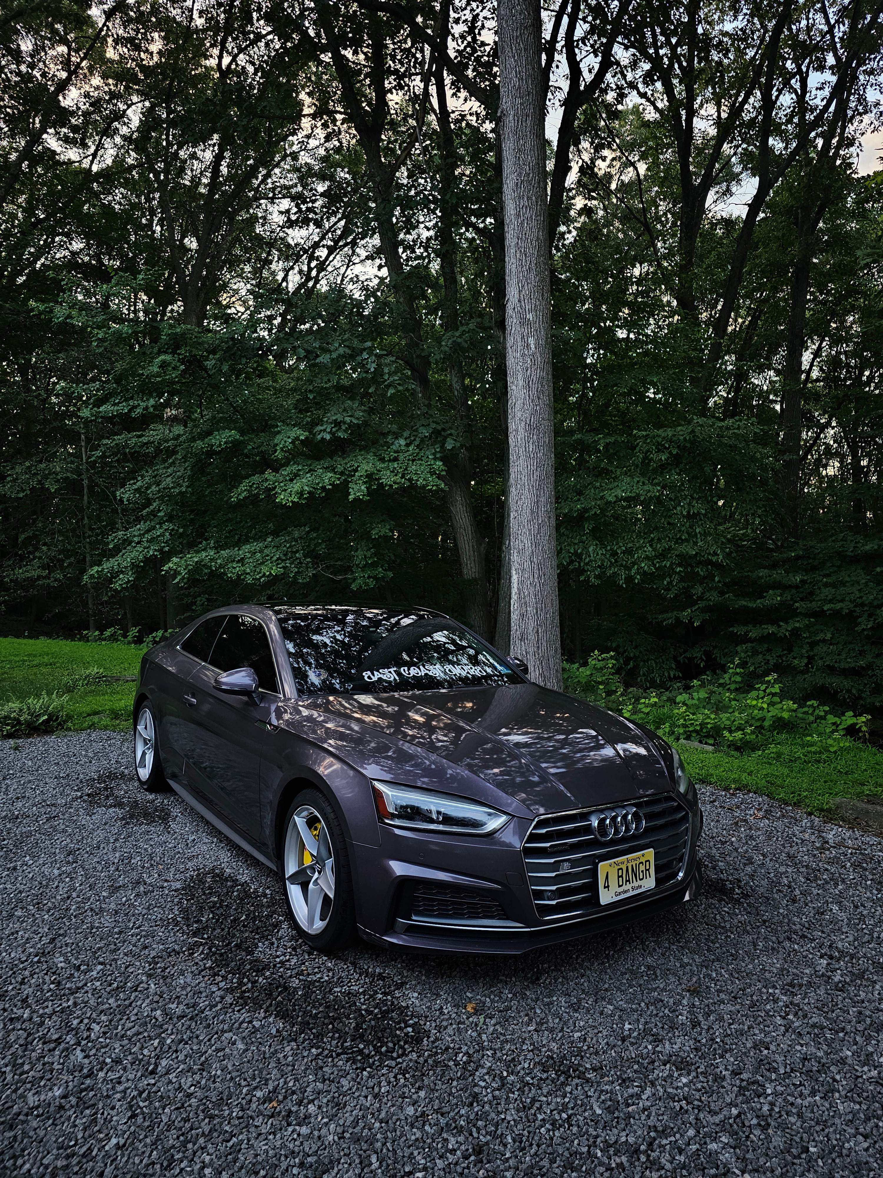 Professionally detailed dark gray Audi sedan showcasing OTR Detail Dynasty's premium automotive detailing services